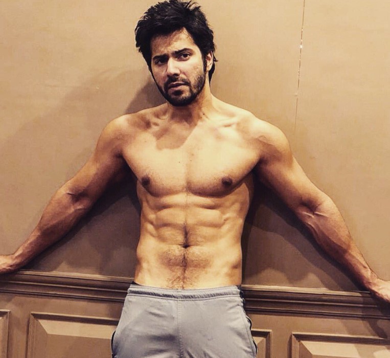 Varun Dhawan flaunts his six-packs; Taapsee Pannu savagely trolls him!